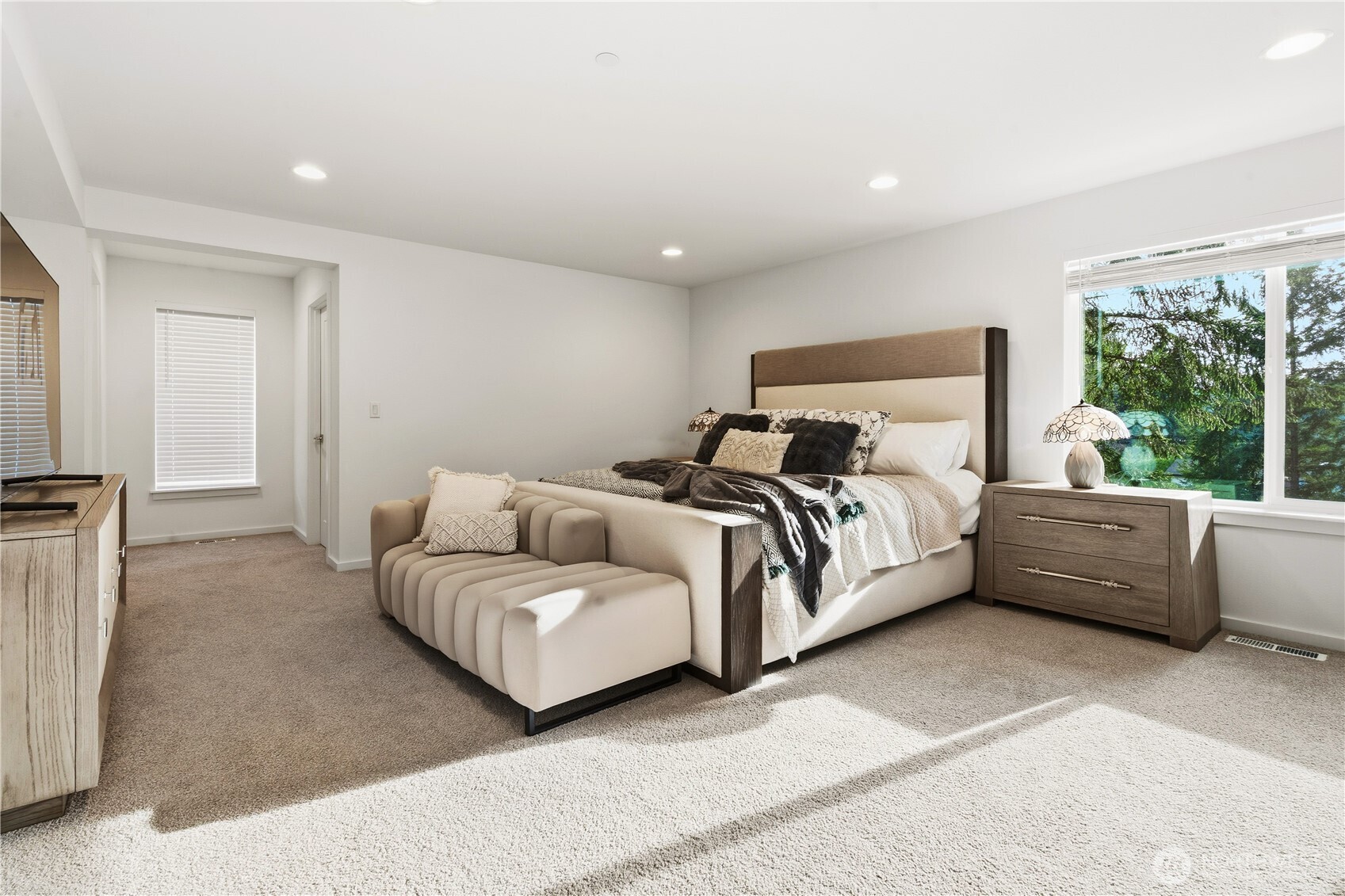 6563 Southeast 8th Street Renton, WA 98059 - Photo 24 of 40 a spacious bedroom with a bed and a couch