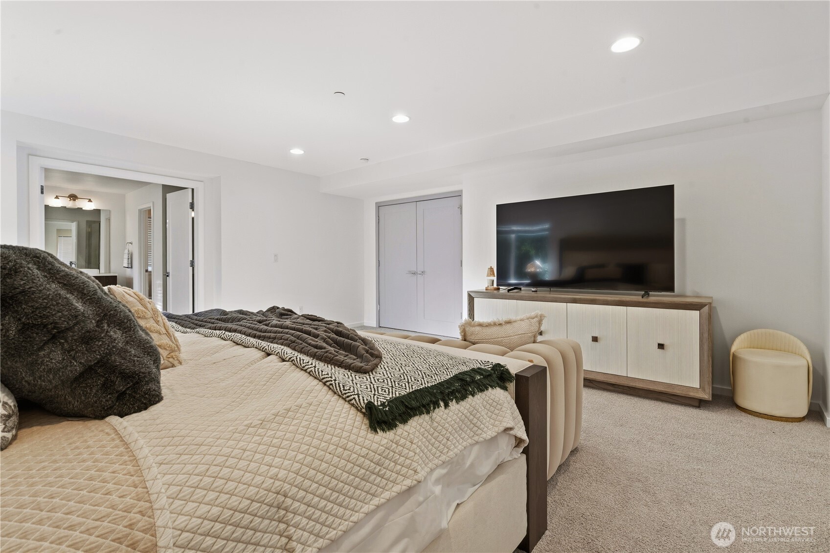 6563 Southeast 8th Street Renton, WA 98059 - Photo 26 of 40 a bedroom with a bed and a flat screen tv