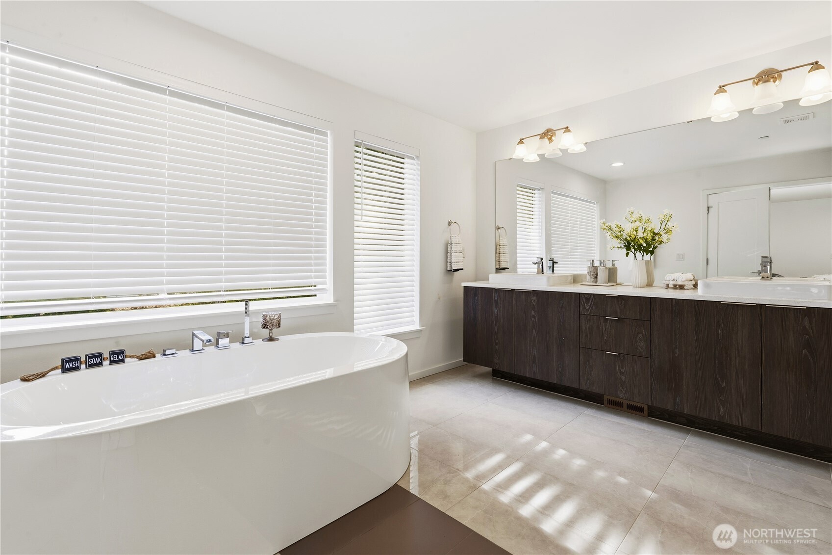 6563 Southeast 8th Street Renton, WA 98059 - Photo 27 of 40 a bathroom with a double vanity sink and mirror