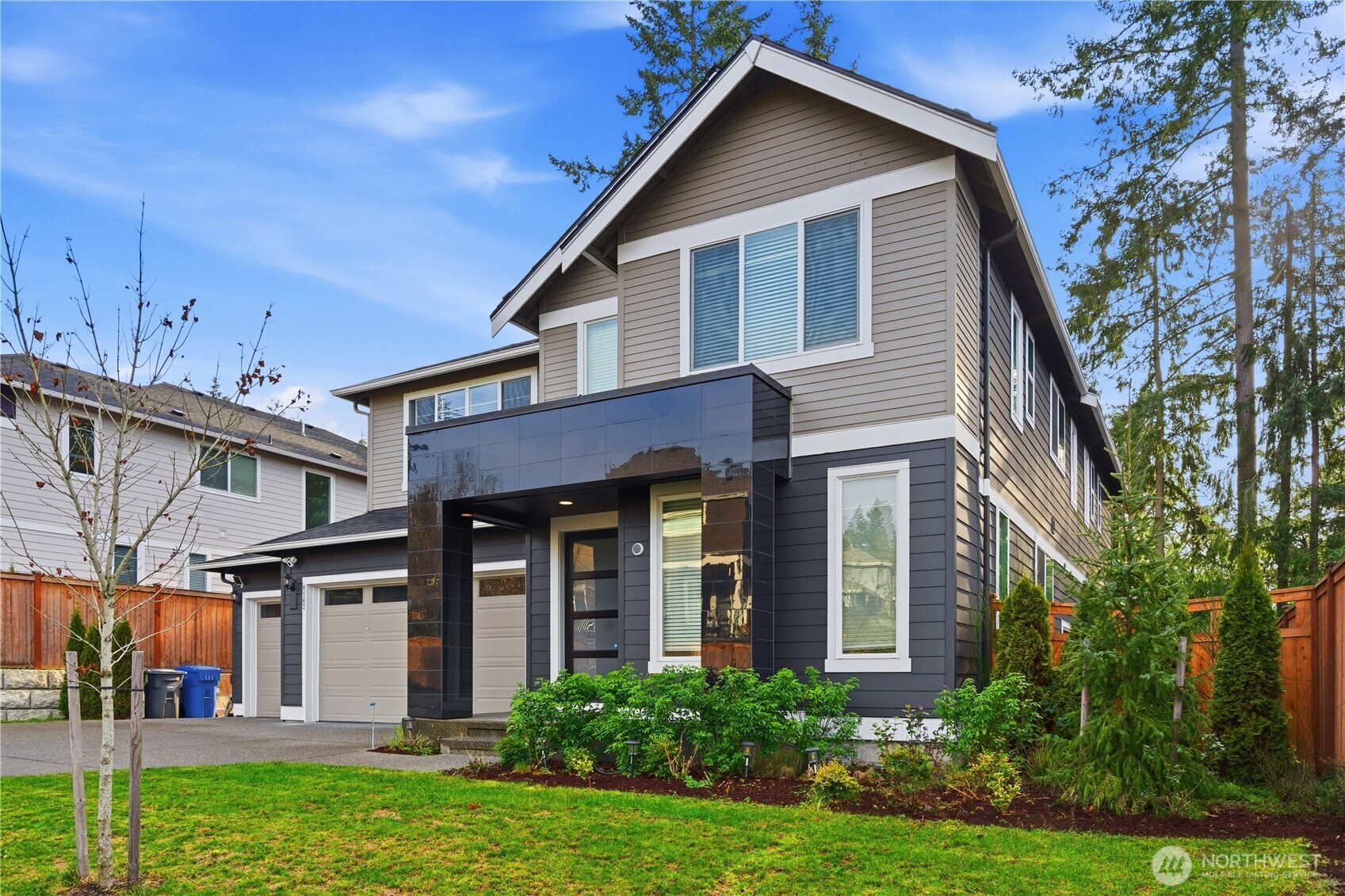 6563 Southeast 8th Street Renton, WA 98059 - Photo 3 of 40 a front view of a house with a yard