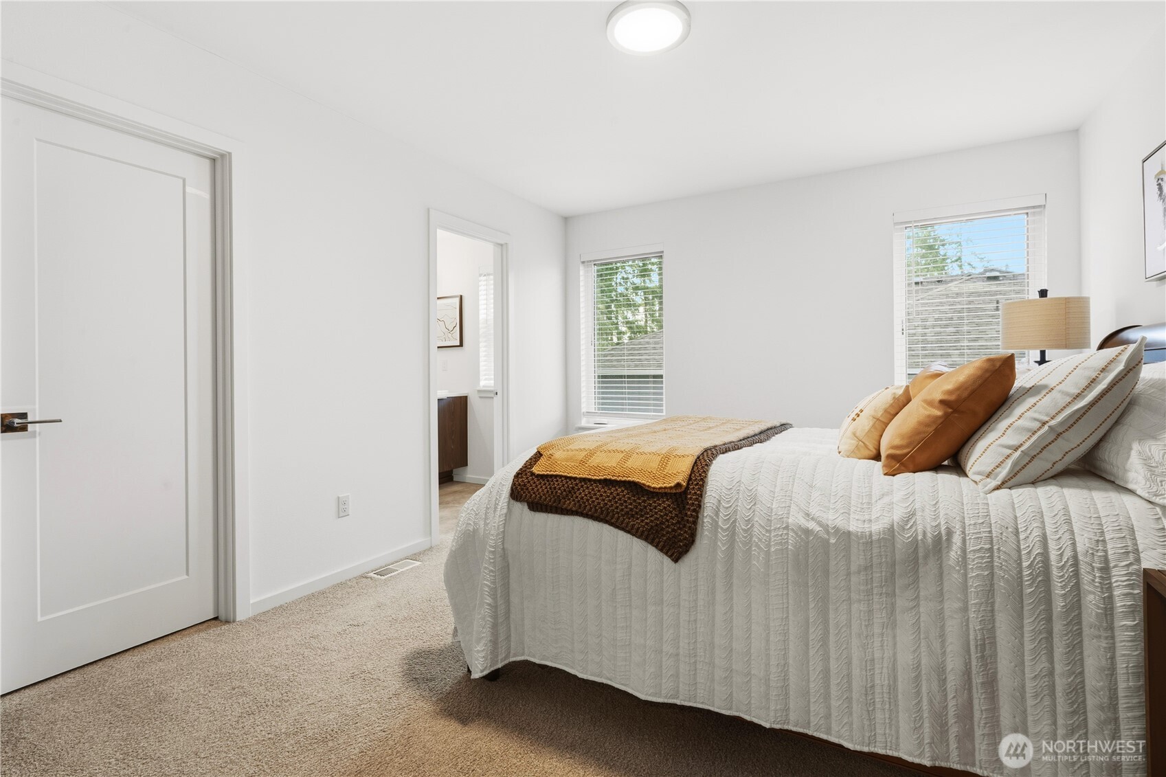 6563 Southeast 8th Street Renton, WA 98059 - Photo 31 of 40 a bedroom with a bed and a window