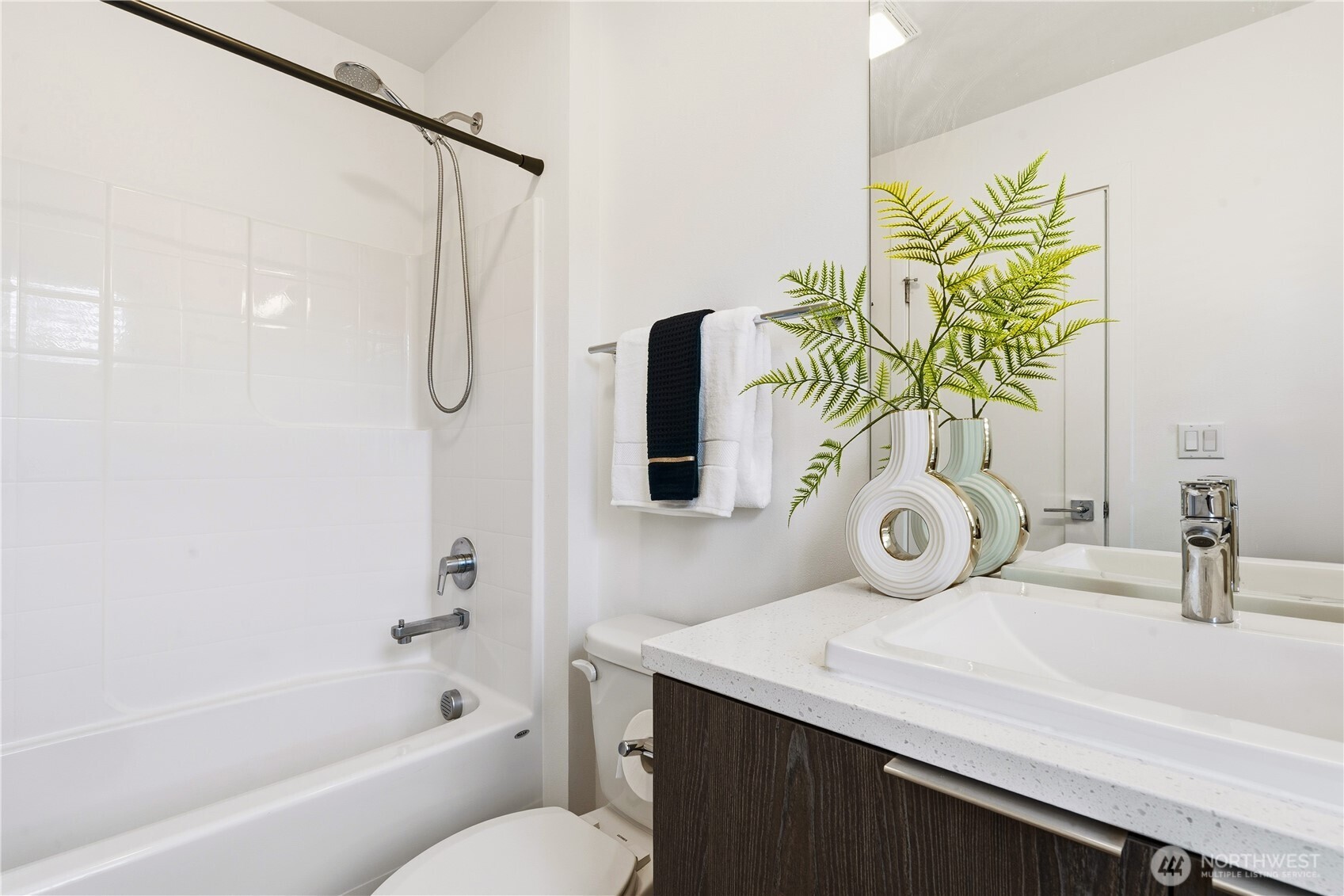 6563 Southeast 8th Street Renton, WA 98059 - Photo 32 of 40 a bathroom with a sink a toilet and shower