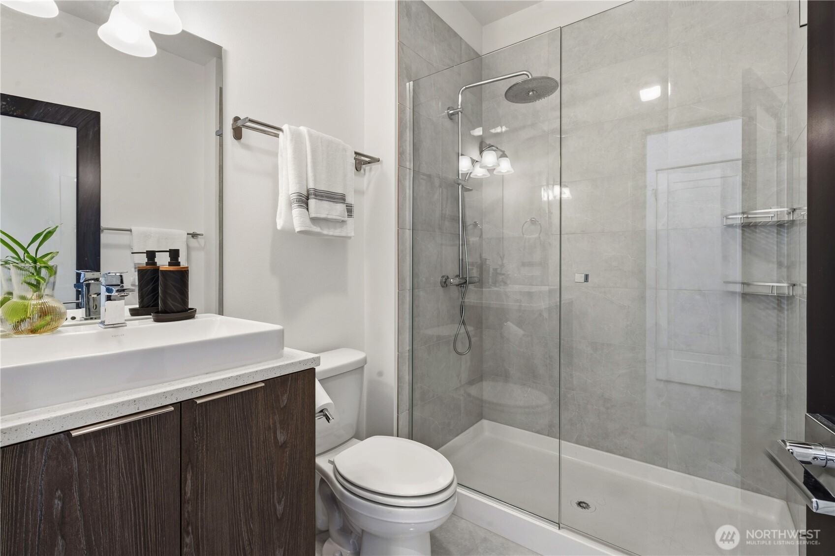 6563 Southeast 8th Street Renton, WA 98059 - Photo 9 of 40 a bathroom with a sink a toilet and shower