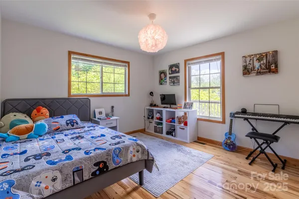 a bedroom that has a bed and a table in it