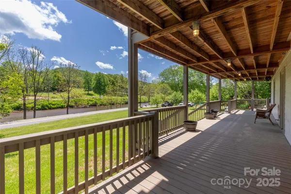 a view of a porch with wooden floor yard