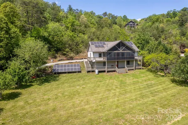 a house with trees in the background