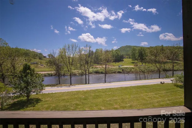 a view of balcony with wooden floor