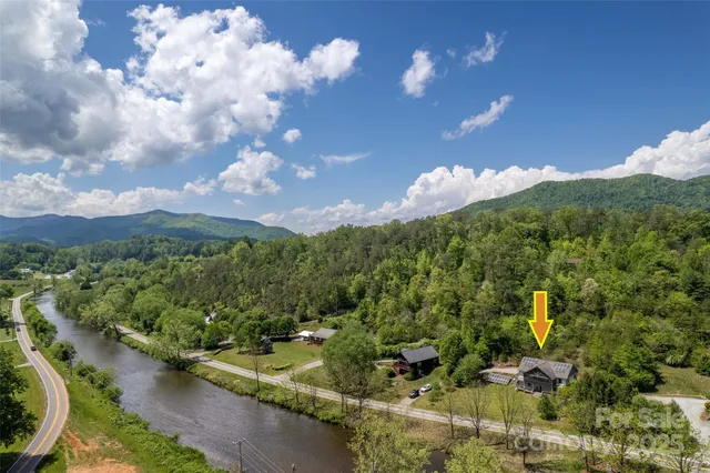 a view of a city with lush green forest