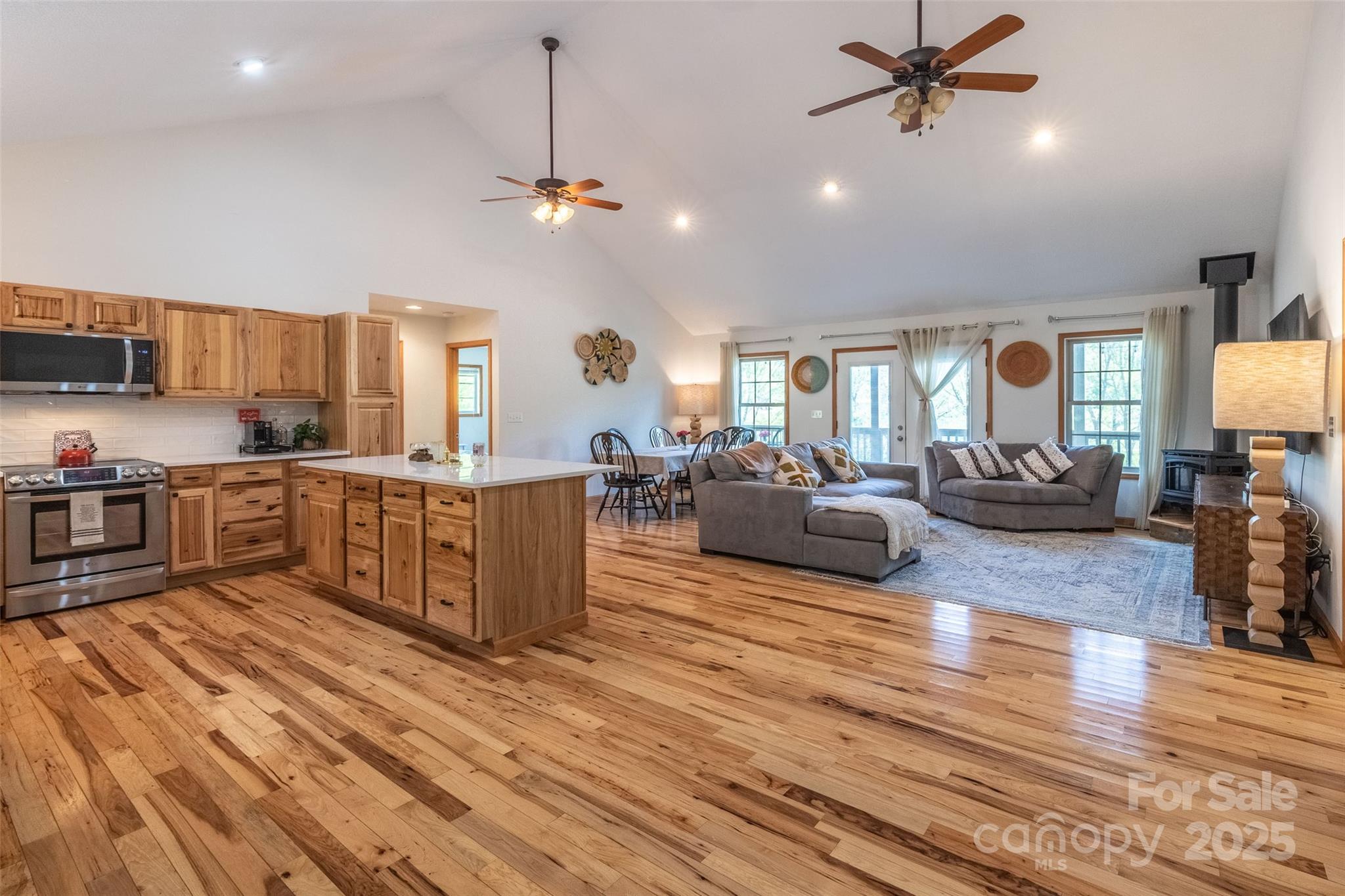 980 South River Road Sylva, NC 28779 - Photo 5 of 41 a living room with couches and kitchen view with wooden floor