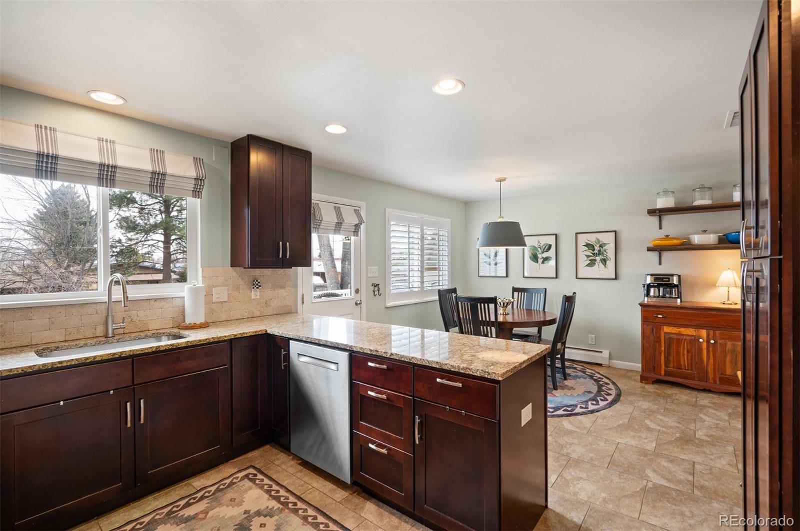 4 Skyline Drive Wheat Ridge, CO 80215 - Photo 11 of 41 a kitchen with granite countertop lots of counter top space