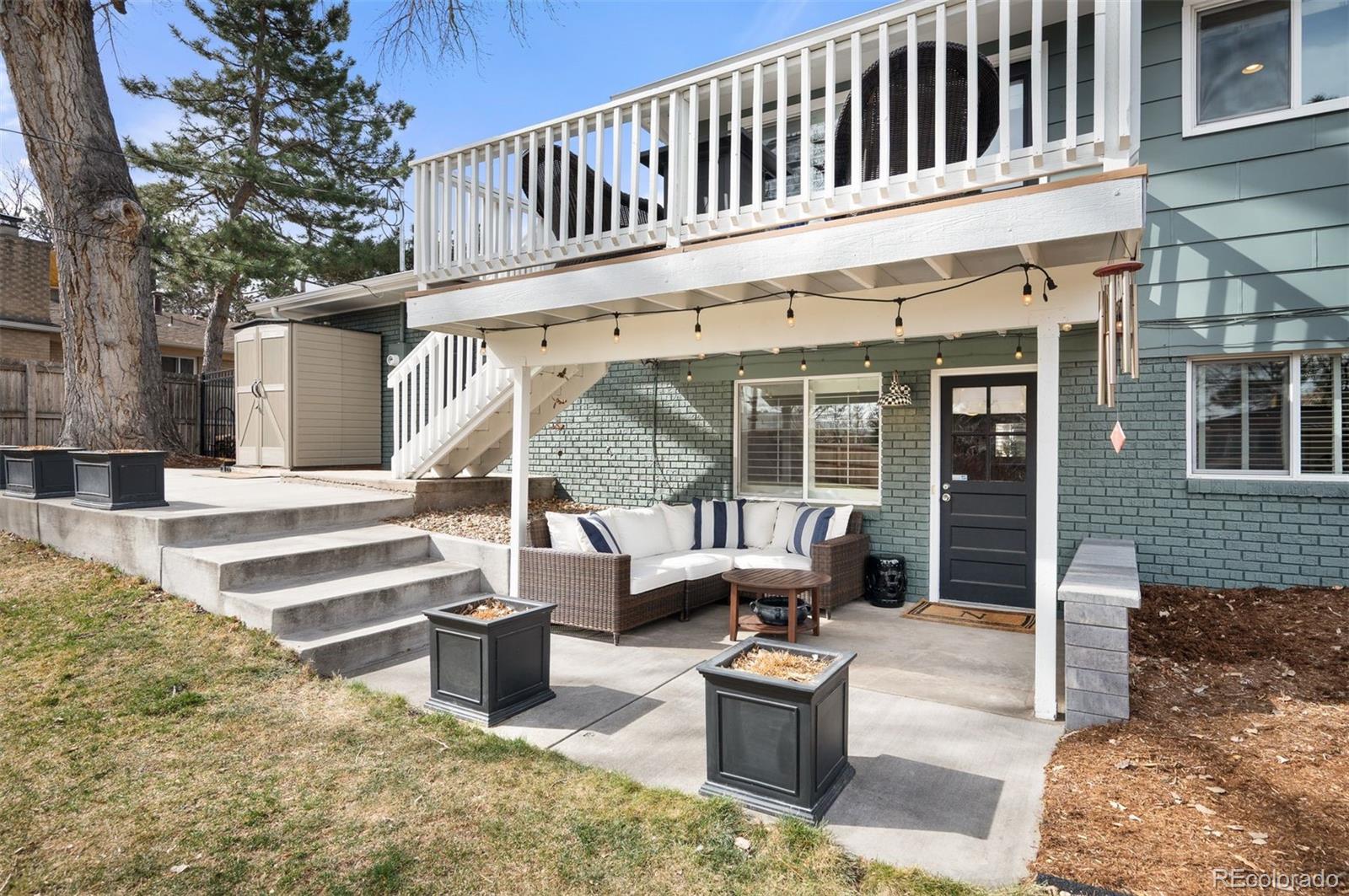 4 Skyline Drive Wheat Ridge, CO 80215 - Photo 15 of 41 a view of a house with backyard and sitting area