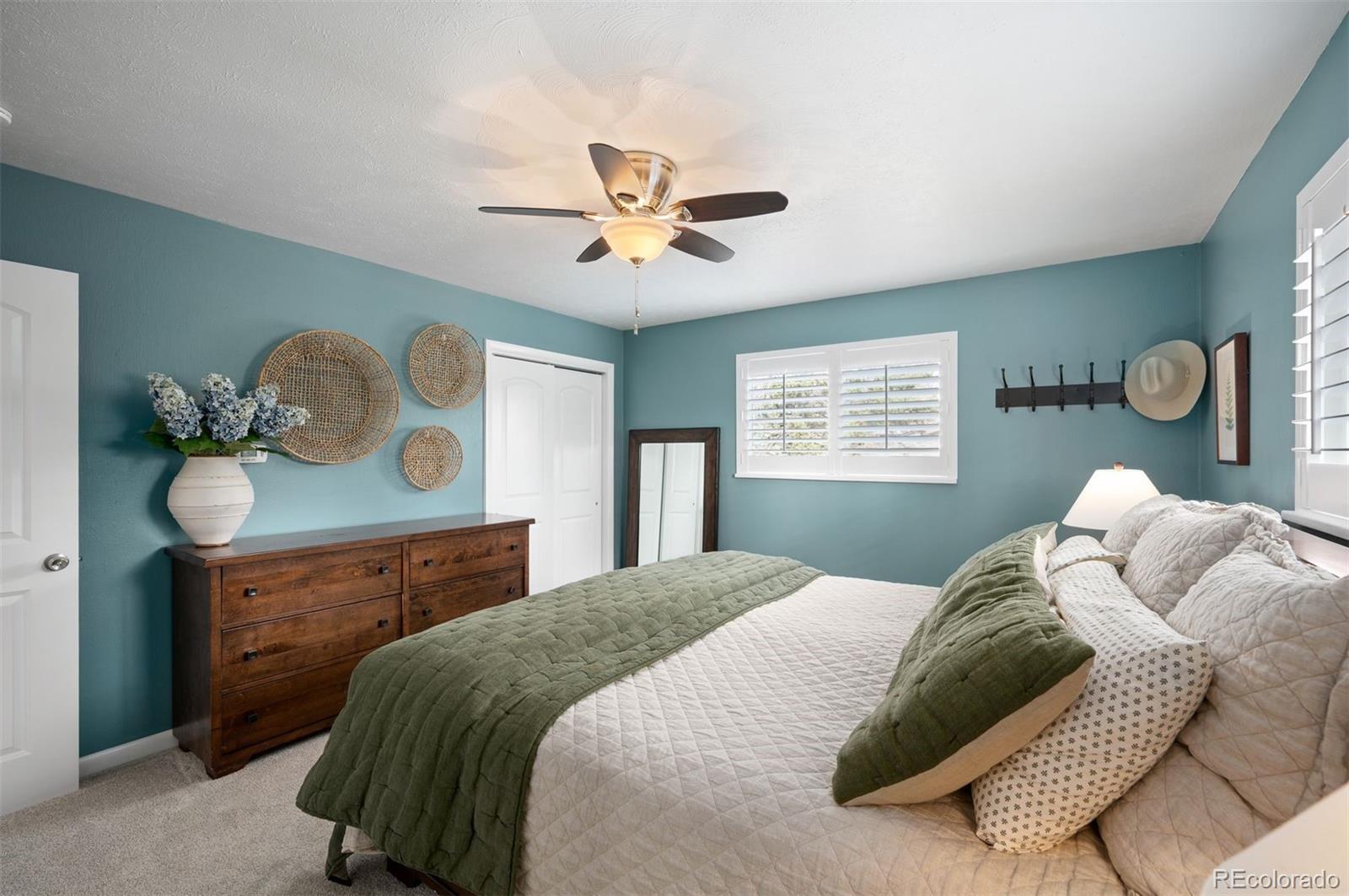 4 Skyline Drive Wheat Ridge, CO 80215 - Photo 17 of 41 a bedroom with a bed and window
