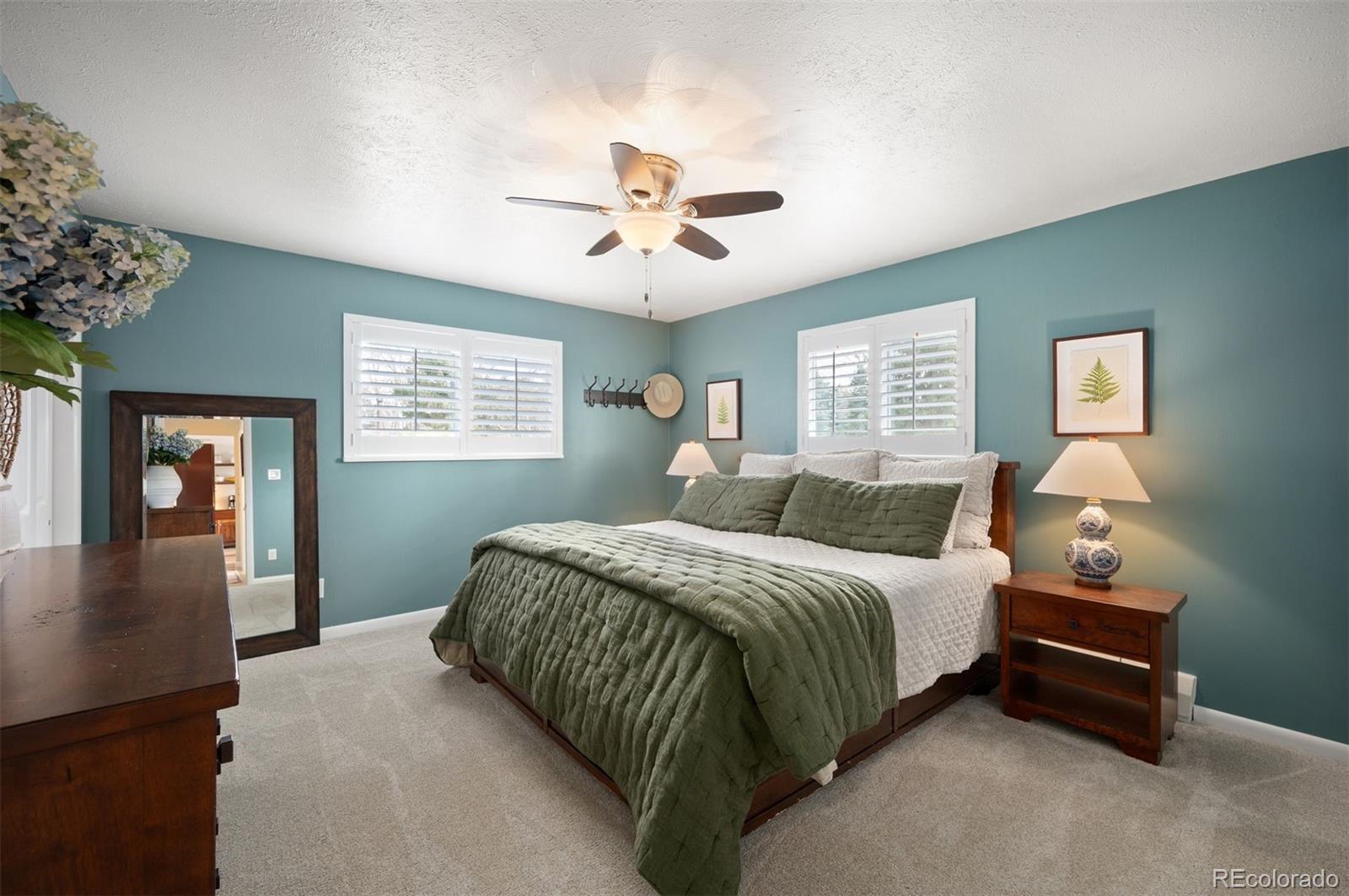 4 Skyline Drive Wheat Ridge, CO 80215 - Photo 18 of 41 a bedroom with a bed dresser and a window