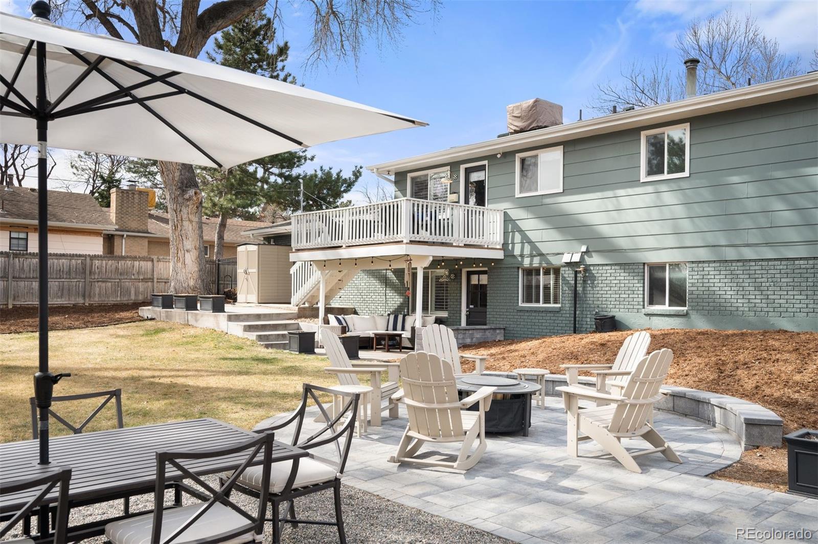 4 Skyline Drive Wheat Ridge, CO 80215 - Photo 2 of 41 a view of a patio with swimming pool table and chairs