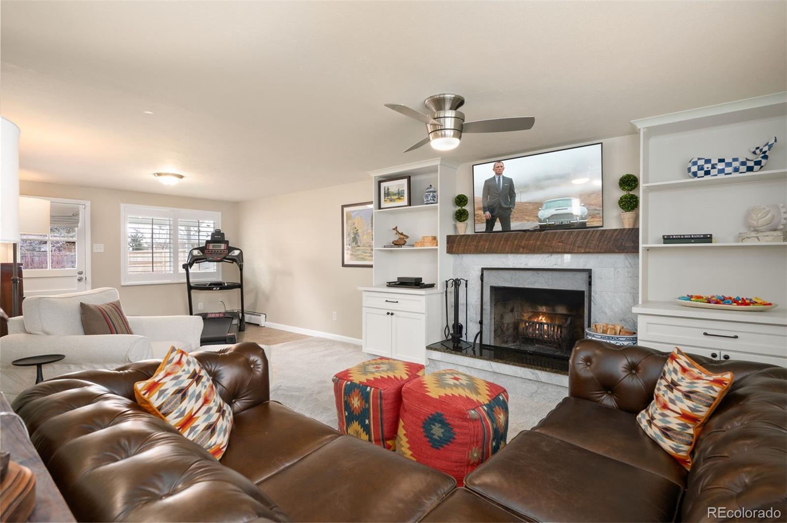 4 Skyline Drive Wheat Ridge, CO 80215 - Photo 24 of 41 a living room with furniture and a fireplace
