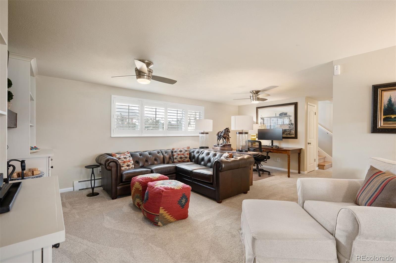 4 Skyline Drive Wheat Ridge, CO 80215 - Photo 26 of 41 a living room with furniture a couch and a window