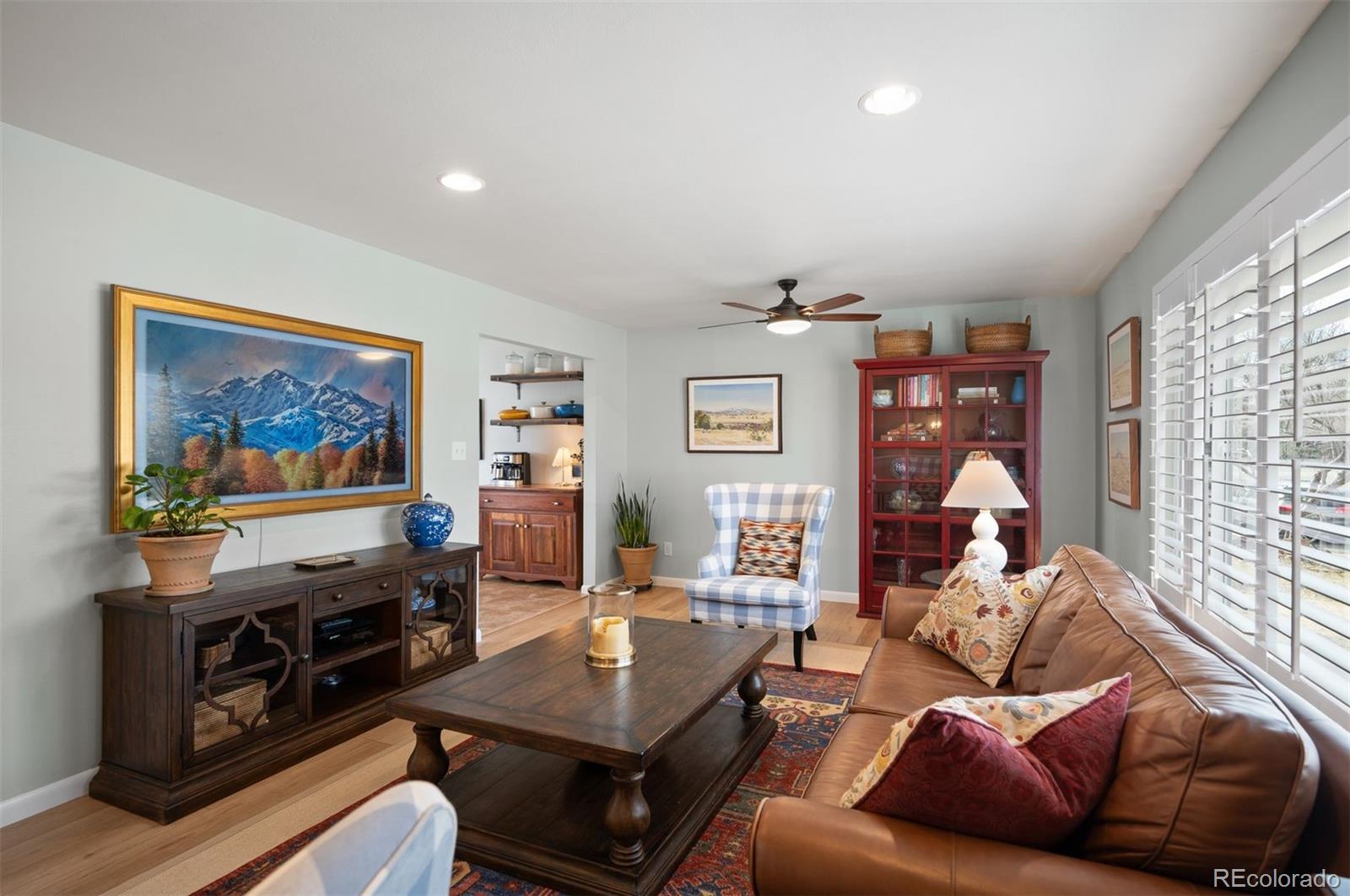 4 Skyline Drive Wheat Ridge, CO 80215 - Photo 3 of 41 a living room with furniture a flat screen tv and a floor to ceiling window