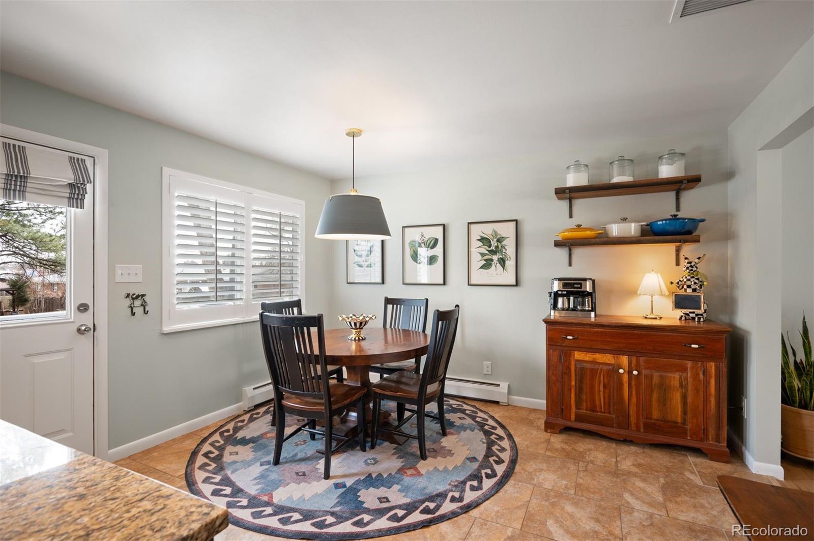 4 Skyline Drive Wheat Ridge, CO 80215 - Photo 8 of 41 a view of a dining room with furniture window and wooden floor