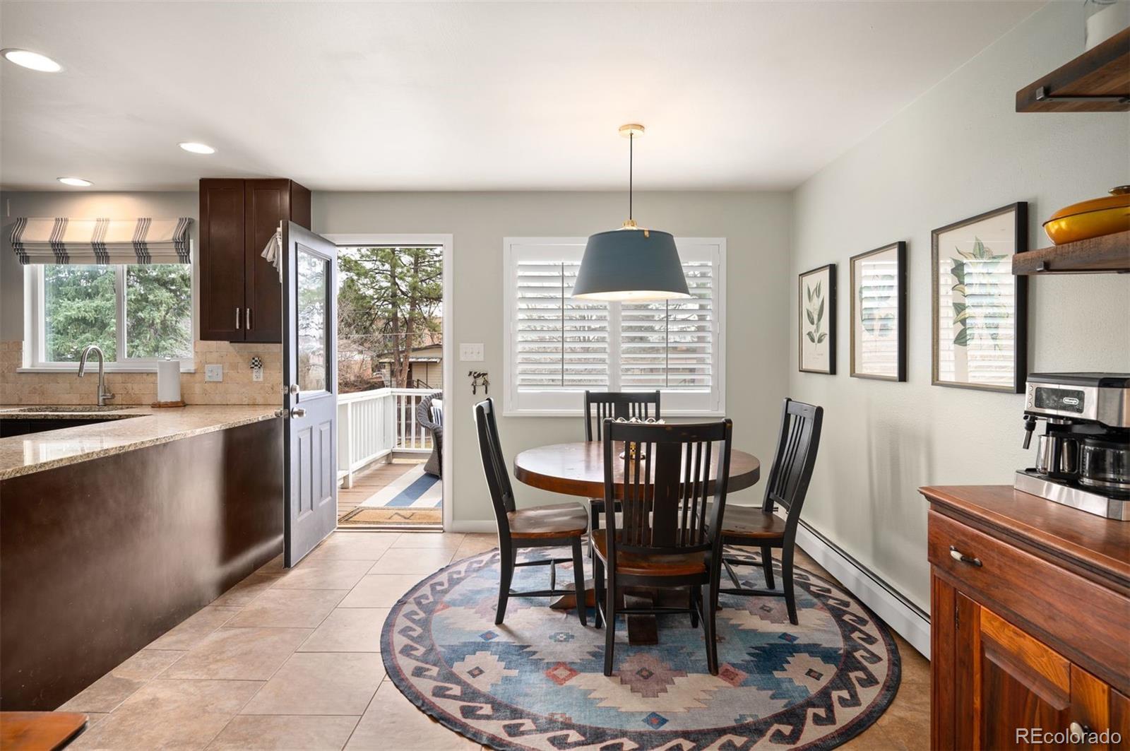 4 Skyline Drive Wheat Ridge, CO 80215 - Photo 9 of 41 a view of a dining room with furniture window and outside view