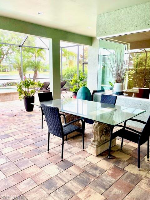 14726 Nautilus Place Naples, FL 34114 - Photo 5 of 21 a view of a dining room with furniture window and outside view