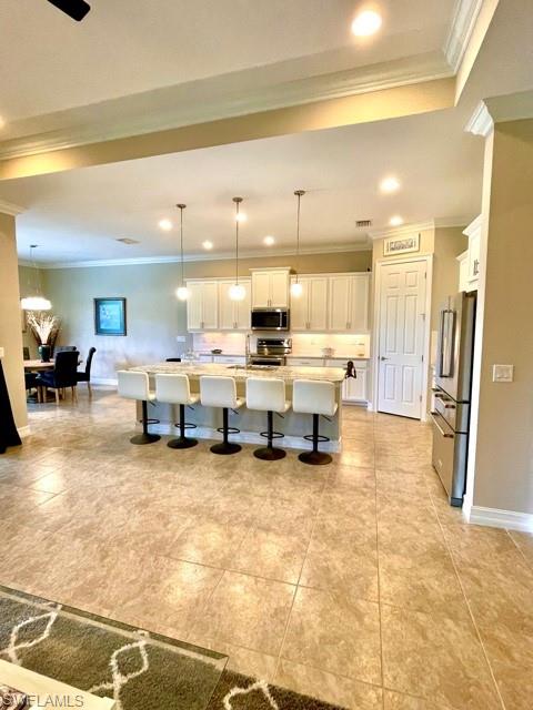 14726 Nautilus Place Naples, FL 34114 - Photo 6 of 21 a large room with lots of chairs and chandelier