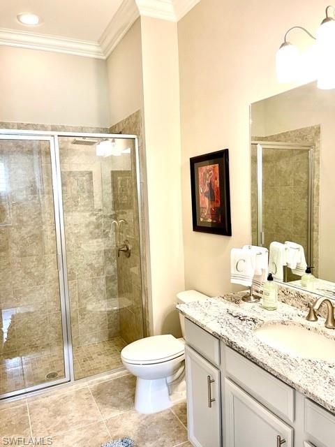14726 Nautilus Place Naples, FL 34114 - Photo 8 of 21 a bathroom with a granite countertop sink a toilet a mirror and shower