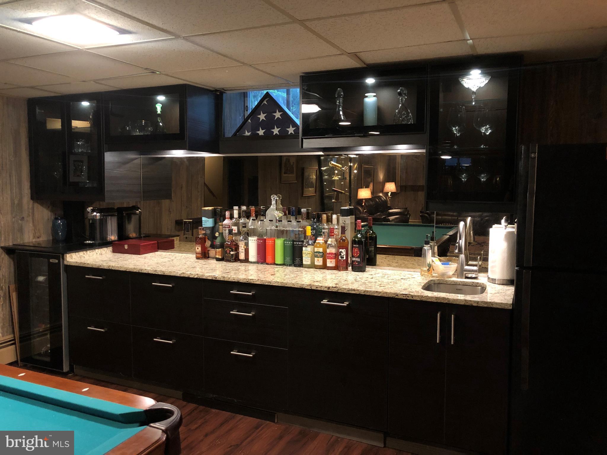 9305 Mathis Avenue Manassas, VA 20110 - Photo 28 of 53 Custom wet bar with granite and lighting