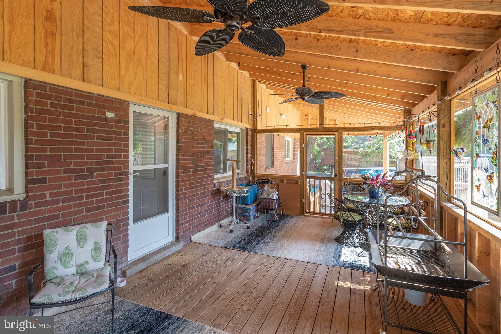 9305 Mathis Avenue Manassas, VA 20110 - Photo 35 of 53 Large screened porch leading to deck and back yard