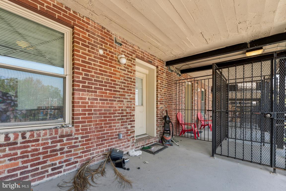 1712 W Street Southeast, Unit 18 Washington, DC 20020 - Photo 15 of 20 a view of a porch with a table and chairs