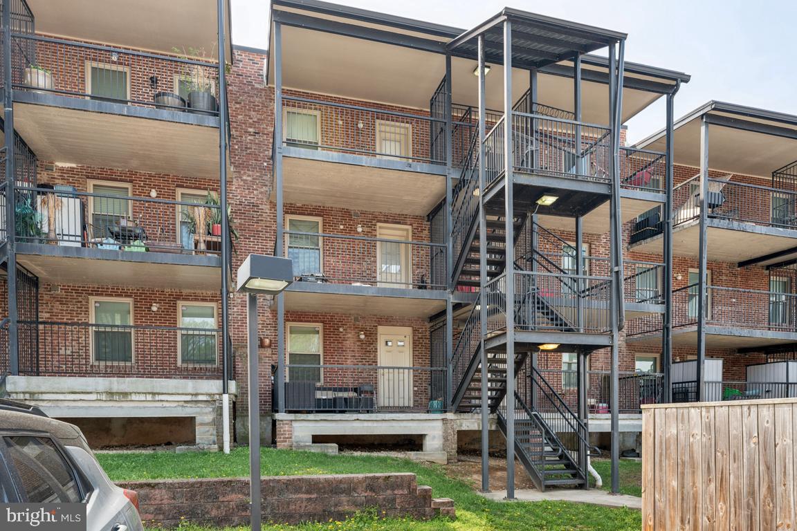1712 W Street Southeast, Unit 18 Washington, DC 20020 - Photo 17 of 20 a view of a building with a yard