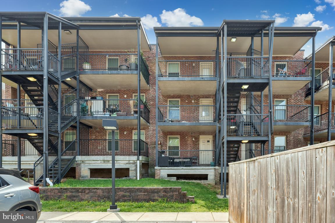 1712 W Street Southeast, Unit 18 Washington, DC 20020 - Photo 19 of 20 a front view of a building with a garden