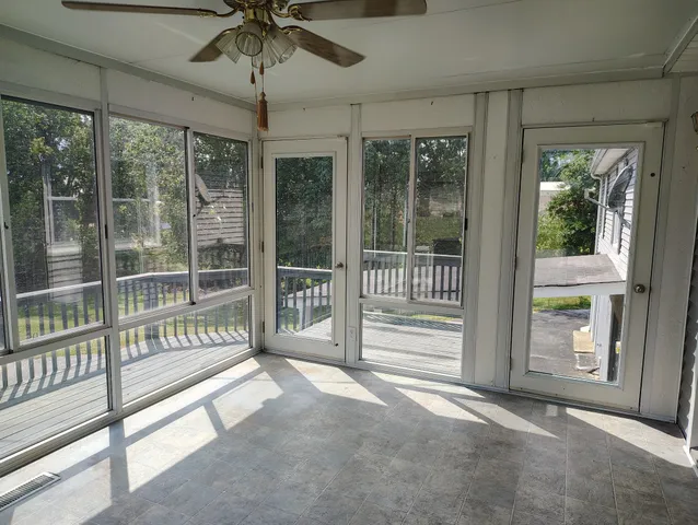 a view of a room with balcony and furniture