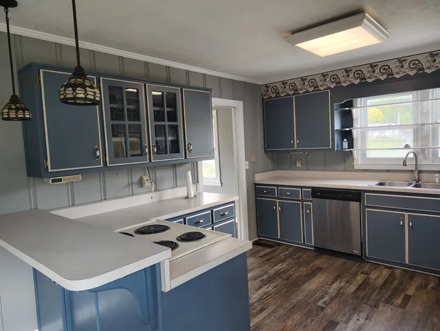 a kitchen with a stove and a sink