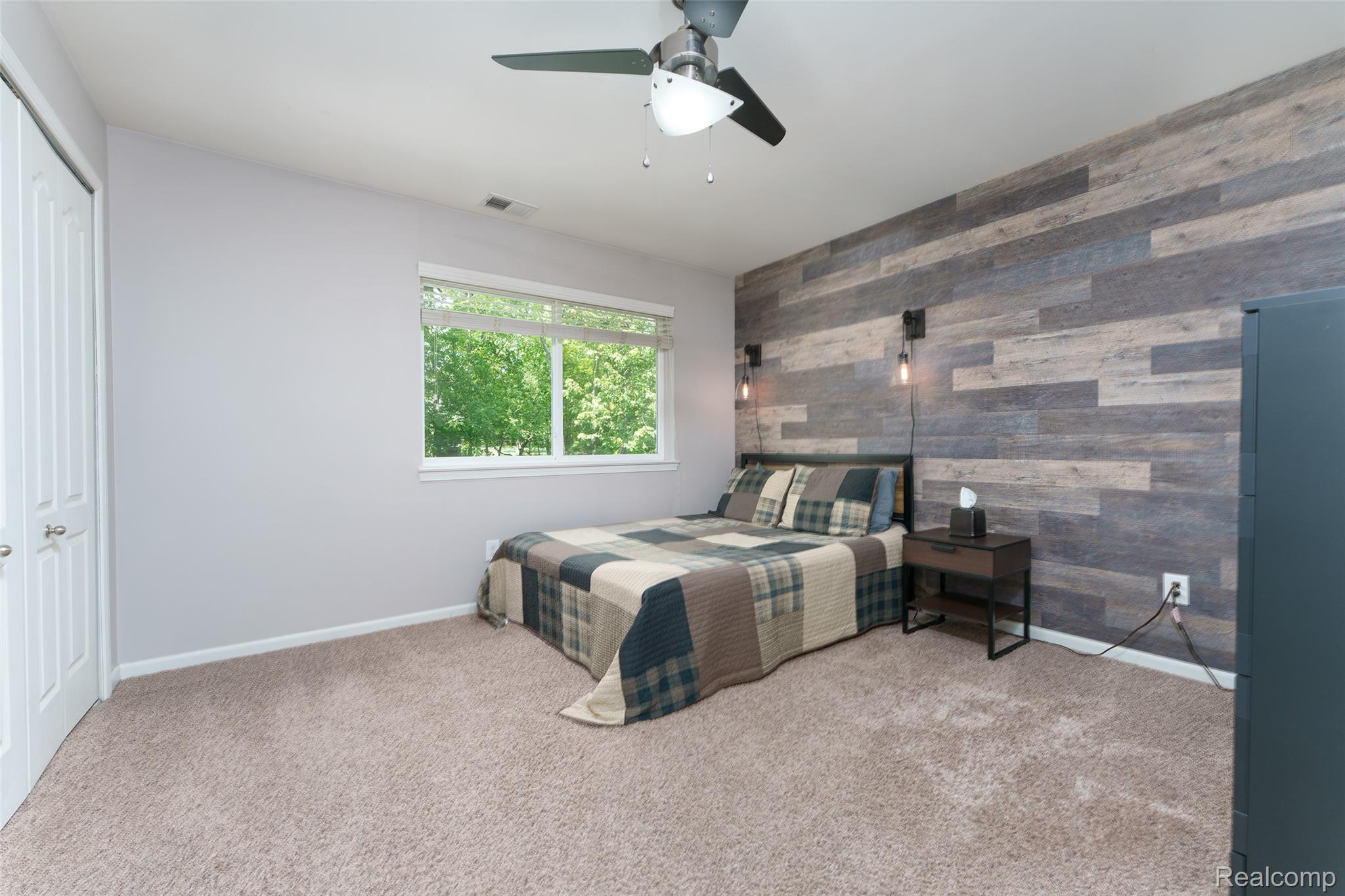 2172 Devonshire Road Bloomfield Hills, MI 48302 - Photo 31 of 45 Bedroom featuring an accent wall and soft carpet flooring