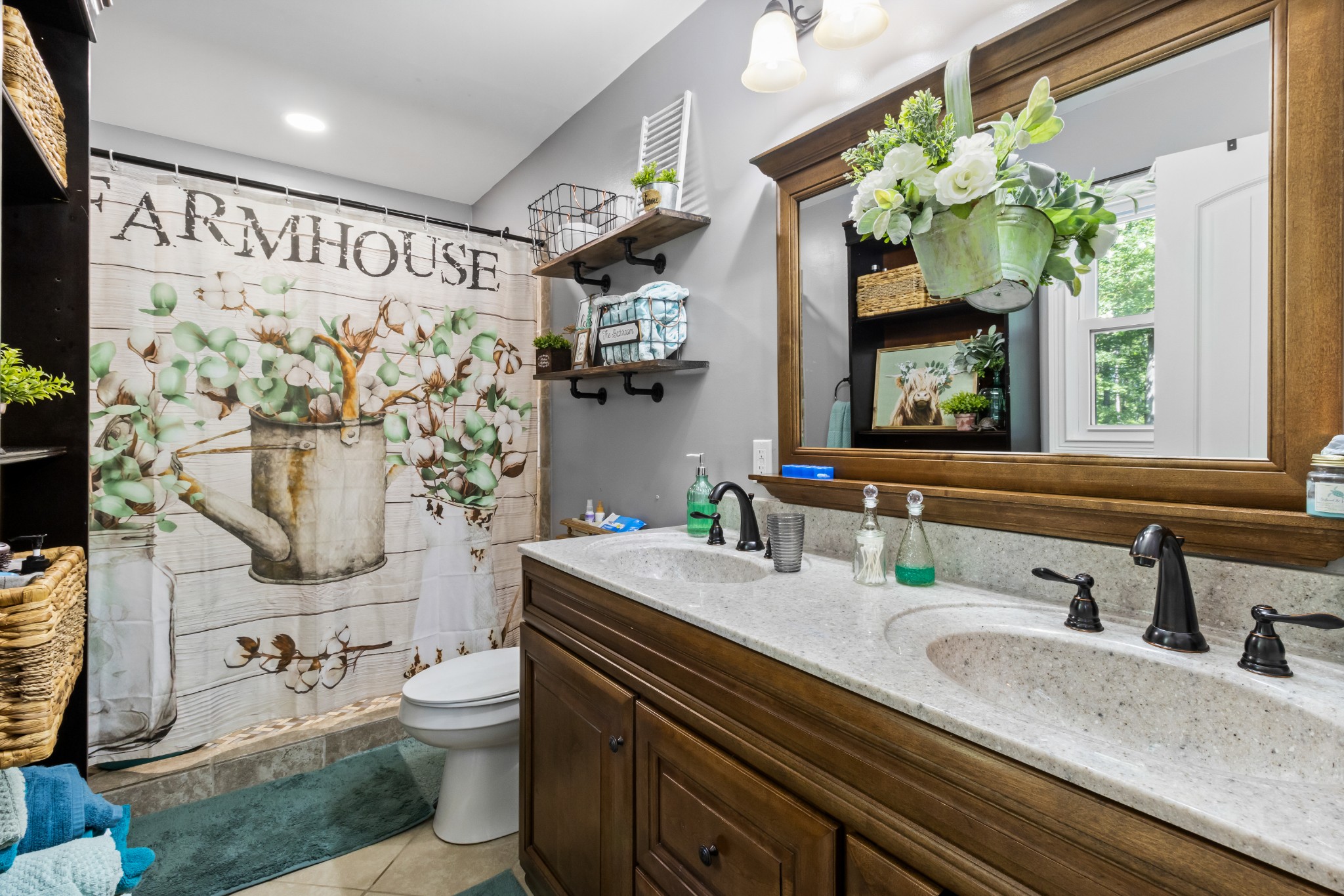 408 Sandy Road Dover, TN 37058 - Photo 15 of 36 a bathroom with a sink a toilet and shower curtain