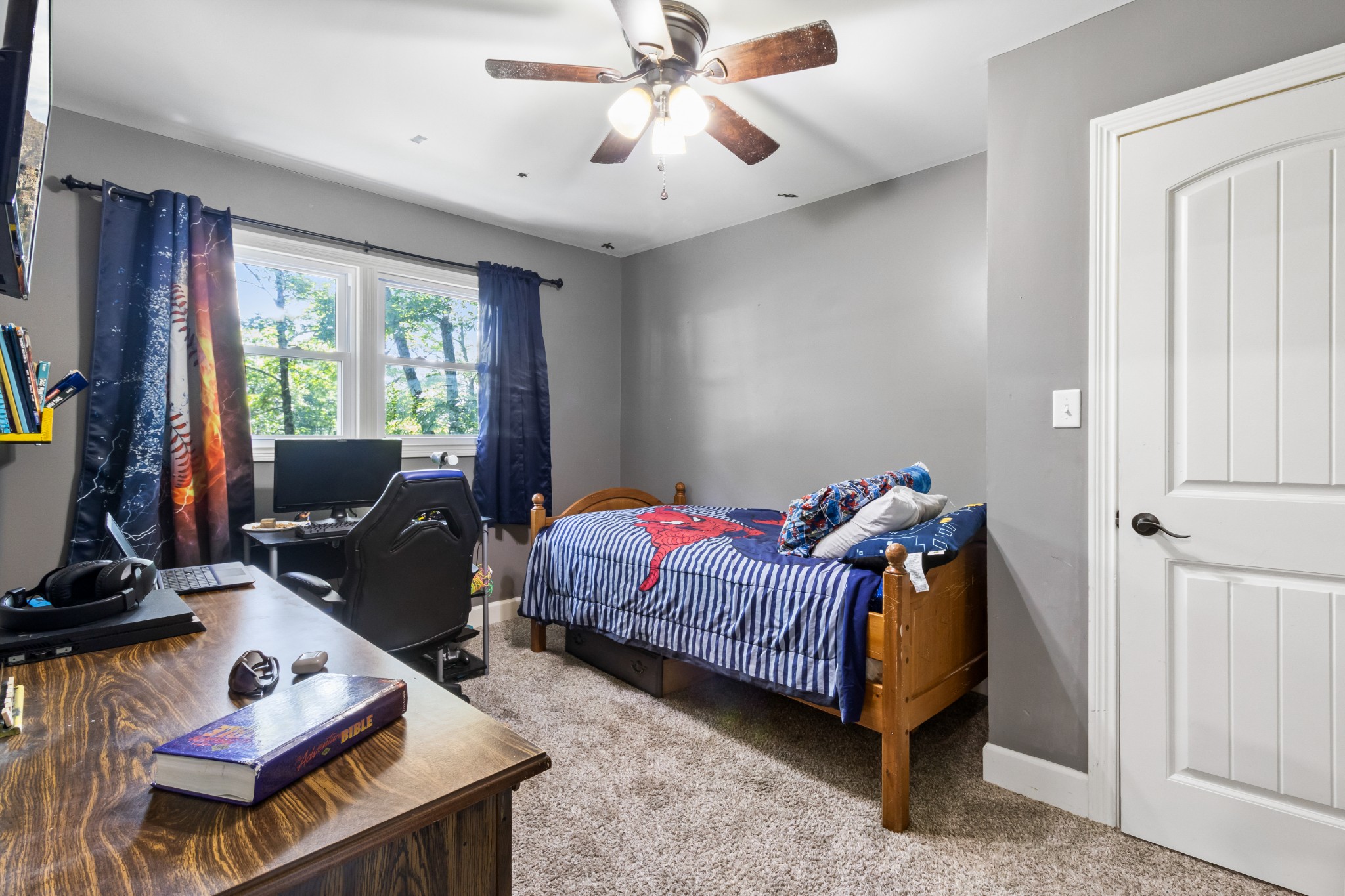 408 Sandy Road Dover, TN 37058 - Photo 18 of 36 a living room with furniture a bed and a chandelier