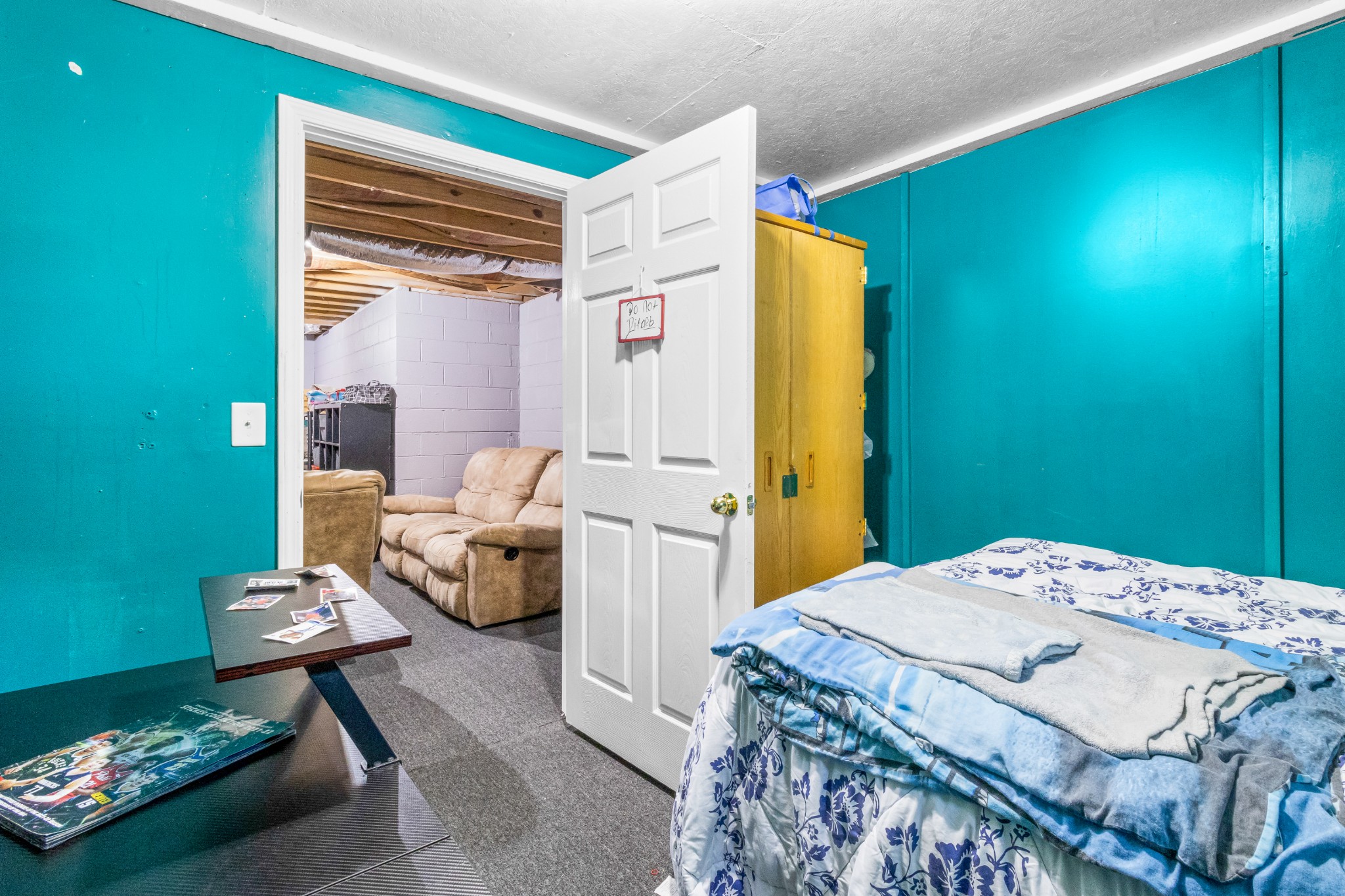 408 Sandy Road Dover, TN 37058 - Photo 22 of 36 a bedroom with a bed and a table in it