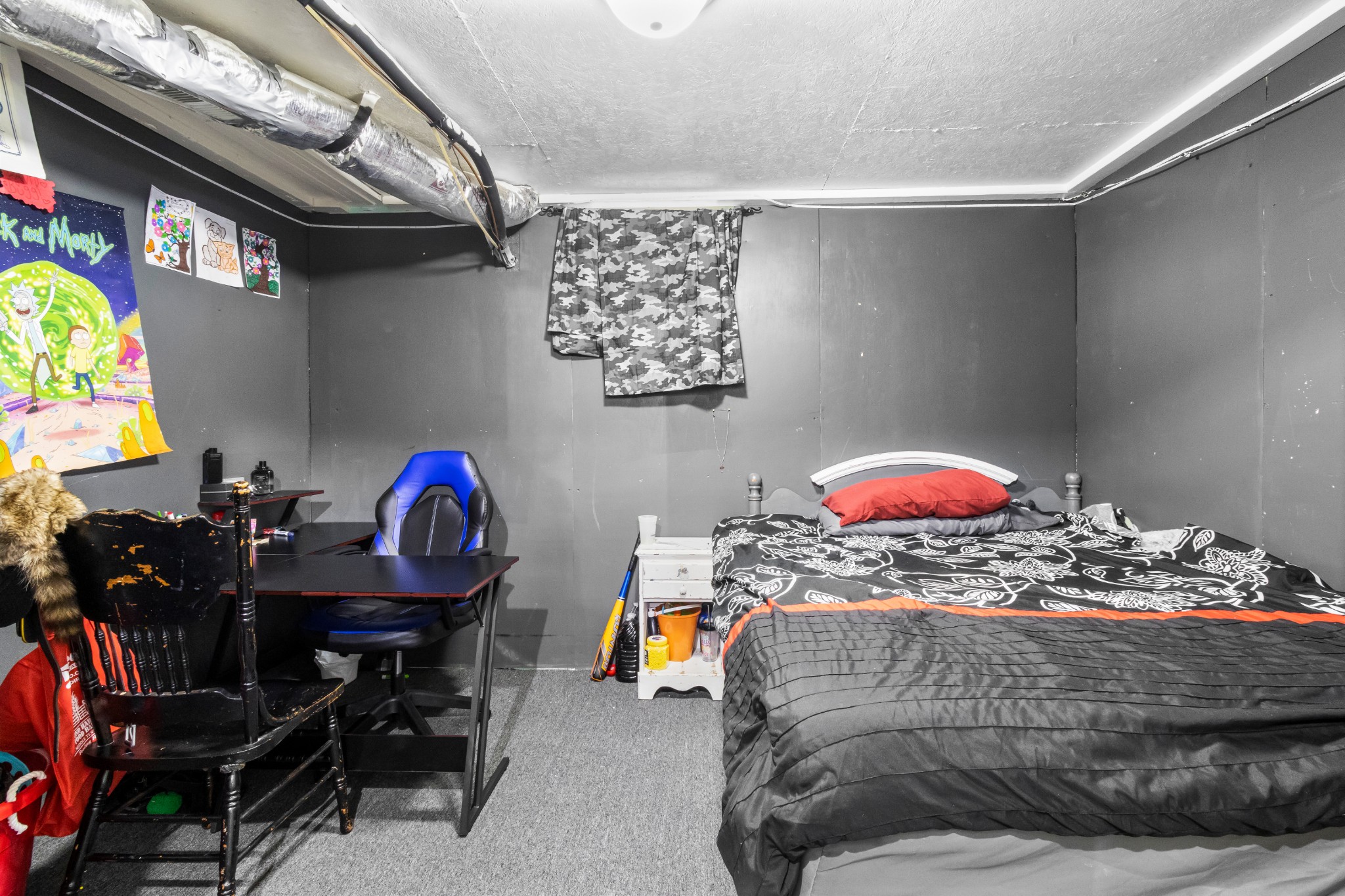 408 Sandy Road Dover, TN 37058 - Photo 23 of 36 a bedroom with a bed and a chandelier