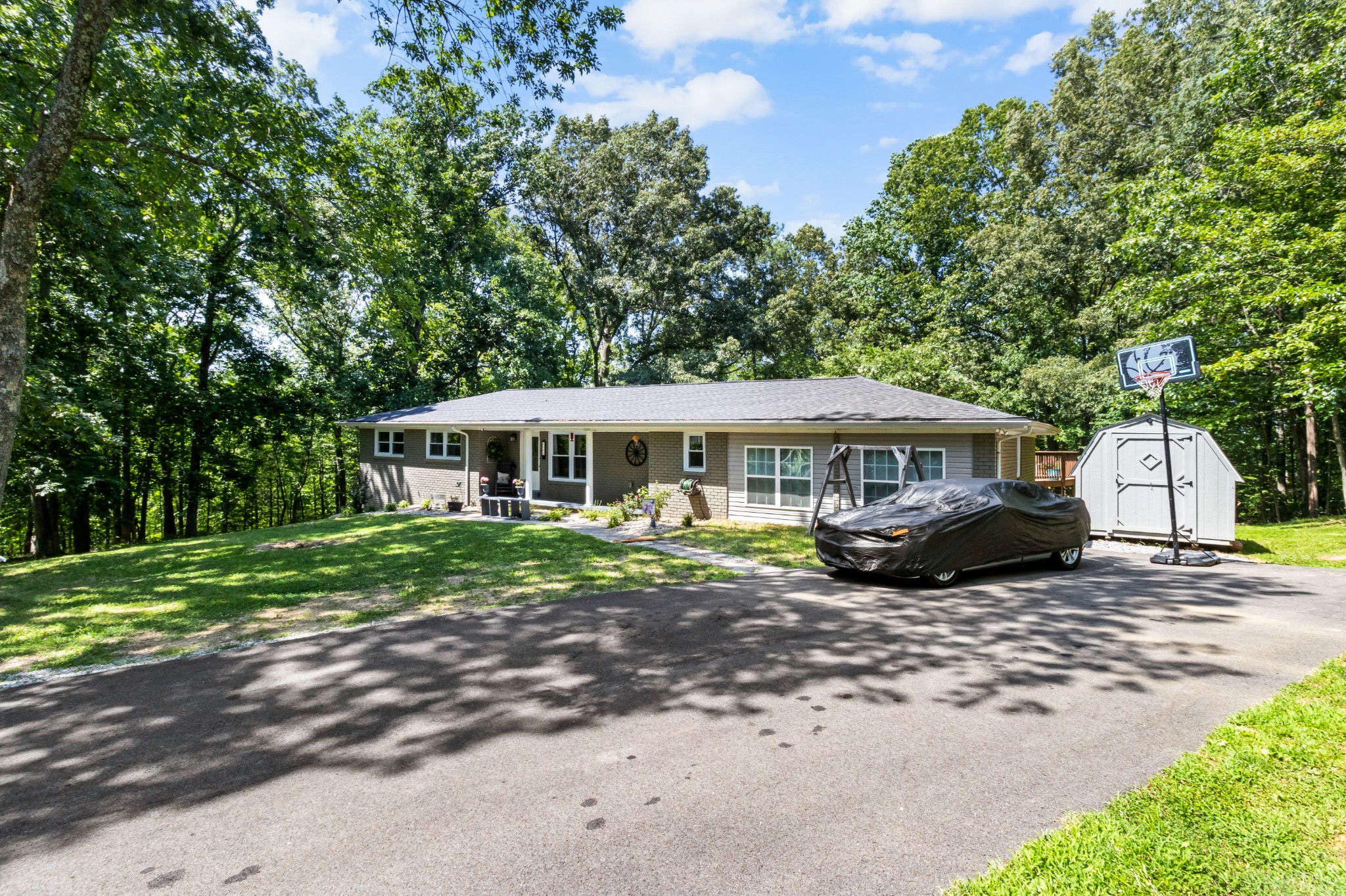 408 Sandy Road Dover, TN 37058 - Photo 35 of 36 a front view of a house with a garden