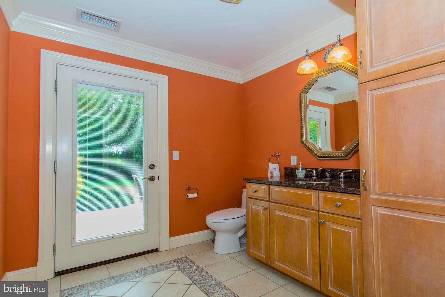 11501 Crows Nest Road Clarksville, MD 21029 - Photo 26 of 60 Main level half bath with door access to patio