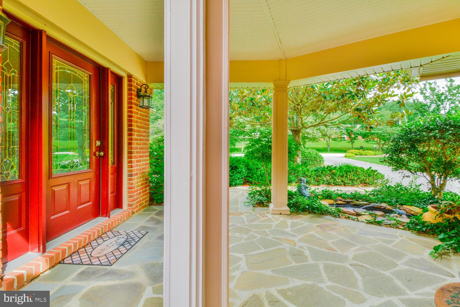 Side covered entrance & fish pond