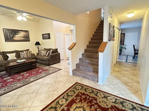 a living room with furniture and a rug