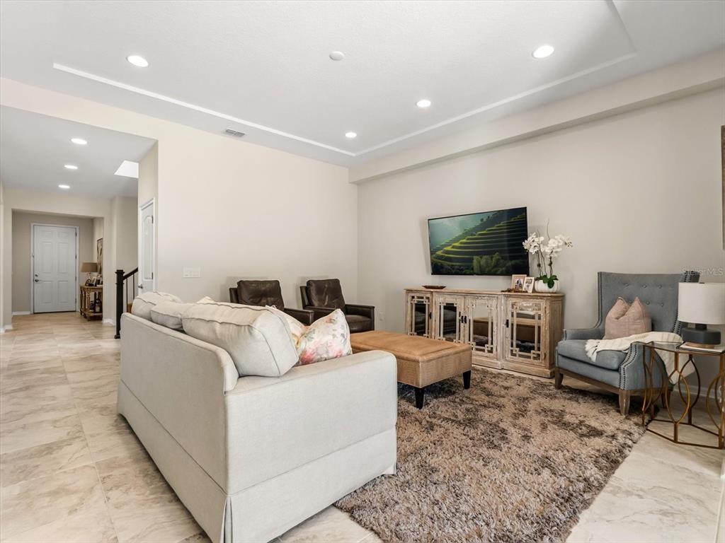 17422 Channel Way Winter Garden, FL 34787 - Photo 12 of 44 a living room with furniture and a flat screen tv
