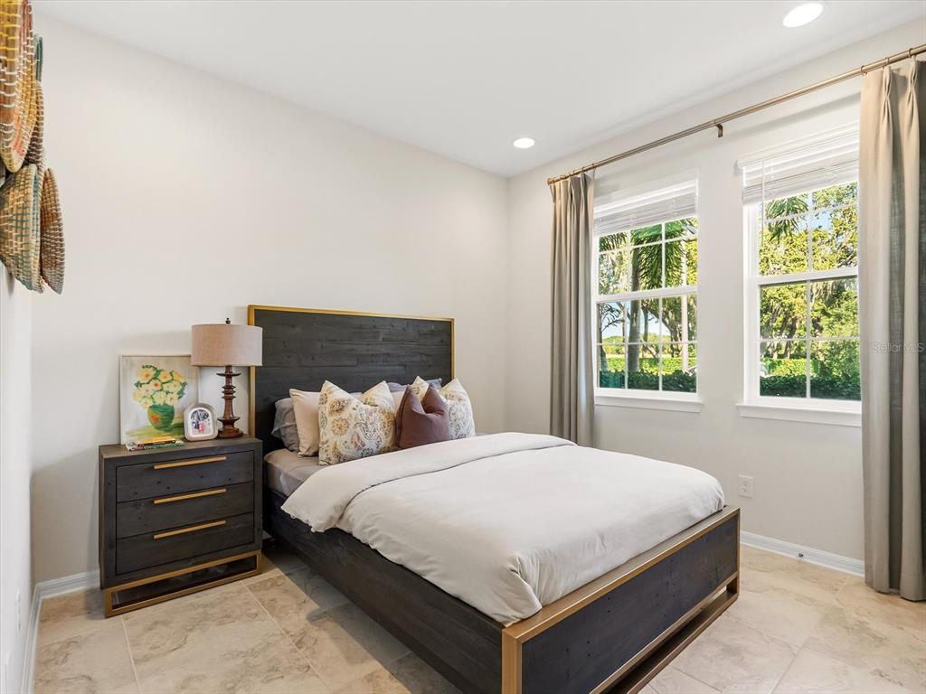 17422 Channel Way Winter Garden, FL 34787 - Photo 13 of 44 a bedroom with a bed and windows