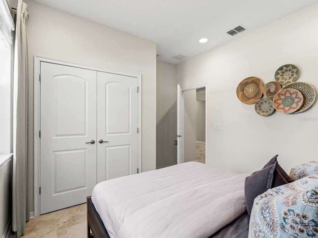 17422 Channel Way Winter Garden, FL 34787 - Photo 14 of 44 a bedroom with a bed and a window