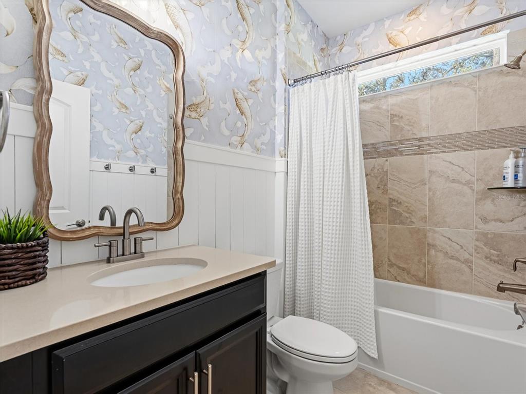 17422 Channel Way Winter Garden, FL 34787 - Photo 15 of 44 a bathroom with a sink a toilet and shower