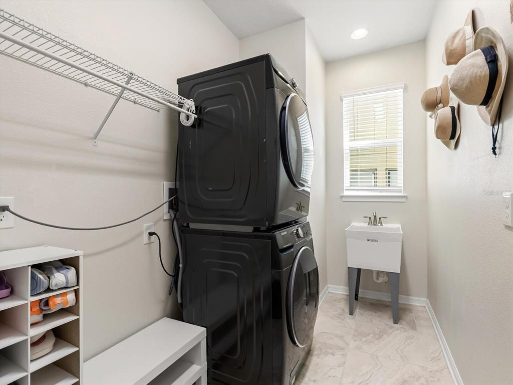 17422 Channel Way Winter Garden, FL 34787 - Photo 17 of 44 a utility room with dryer and washer
