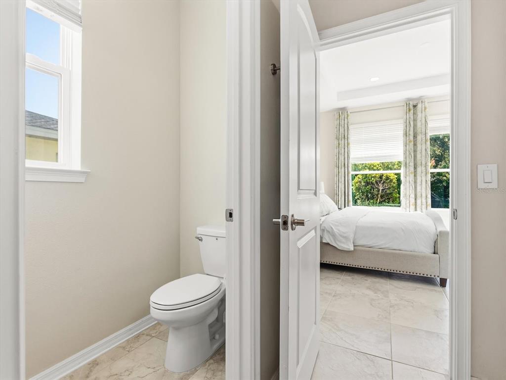 17422 Channel Way Winter Garden, FL 34787 - Photo 23 of 44 a bathroom with a toilet tub and window