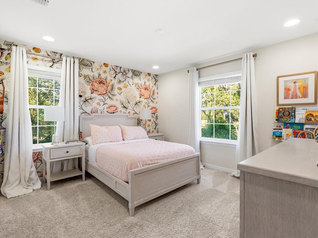 17422 Channel Way Winter Garden, FL 34787 - Photo 26 of 44 a spacious bedroom with a bed and a window