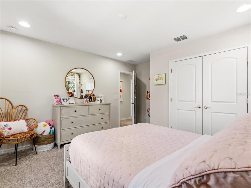 17422 Channel Way Winter Garden, FL 34787 - Photo 27 of 44 a bedroom with a bed and a dresser